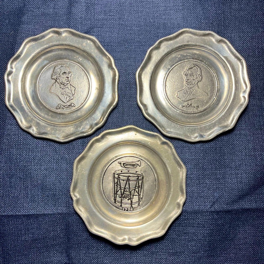 3 Pewter dishes, 5.5” diameter, scrolled rim, Washington, Lincoln,1776 drum.